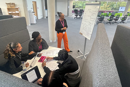 Students working in a pod in the open learning space